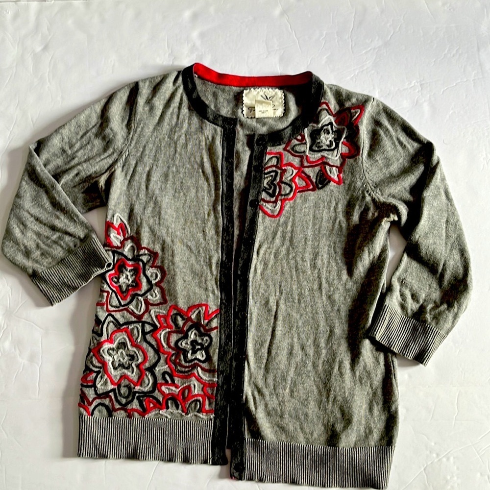 Dark grey with embroiled flowers white and fucsia.